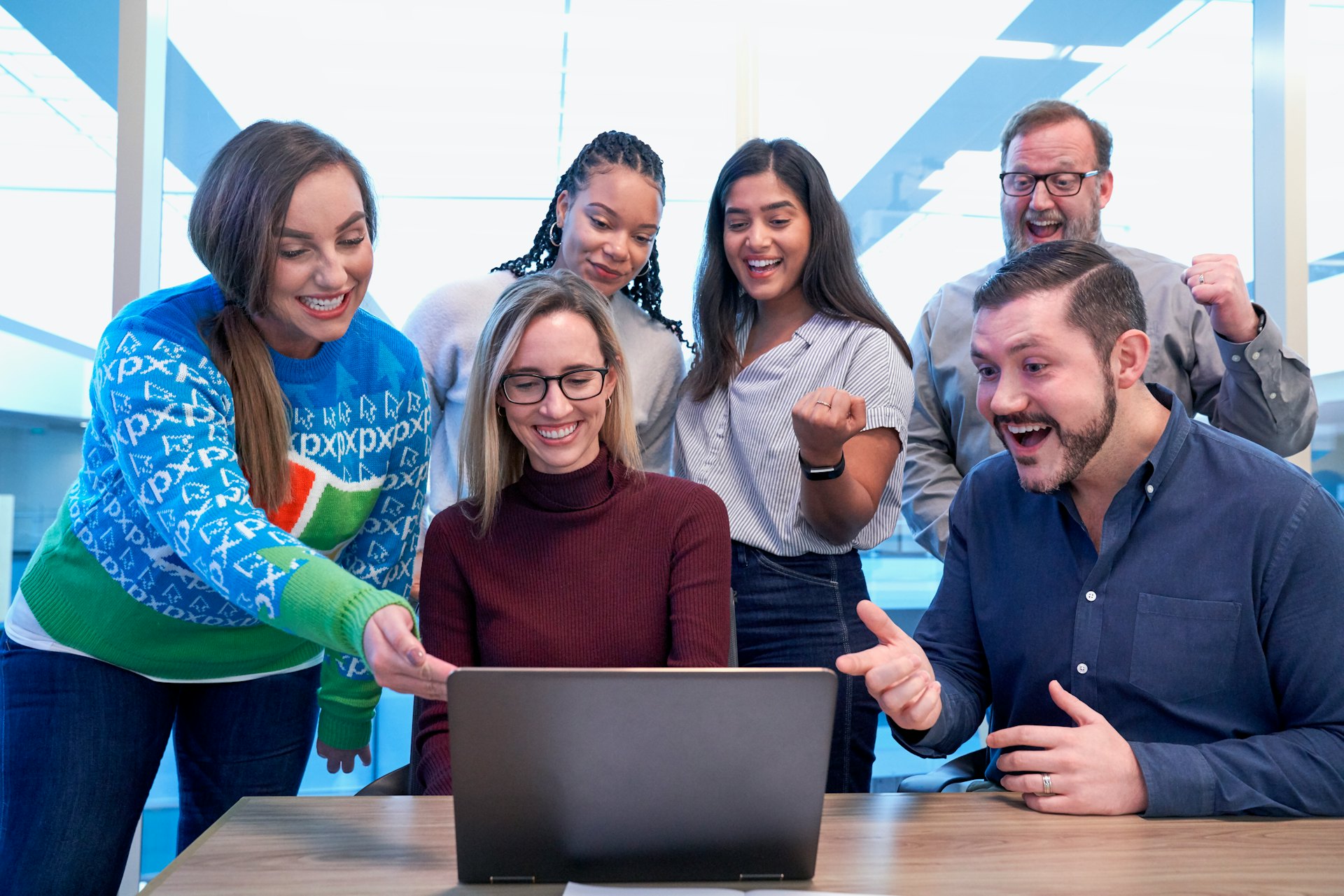 Happy diverse team using Emmato